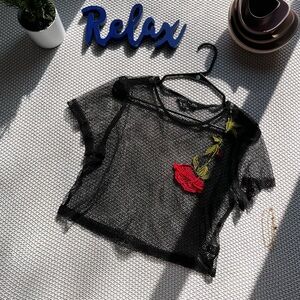 Cute netted cropped top.